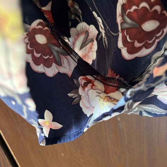 One❤️Clothing navy blue floral long sleeved romper. Size XS. Open V in the back. - Picture 4 of 14